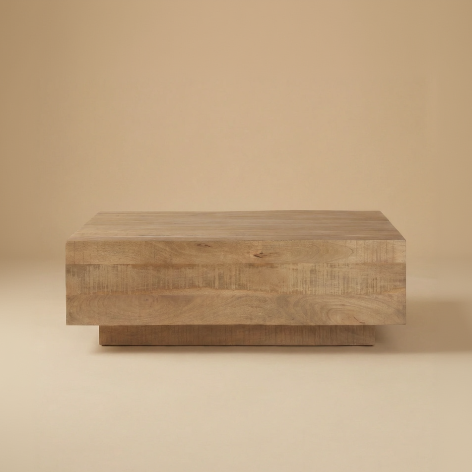 Front view of the Aero wood coffee table highlighting the horizontal plank design and recessed plinth base.
