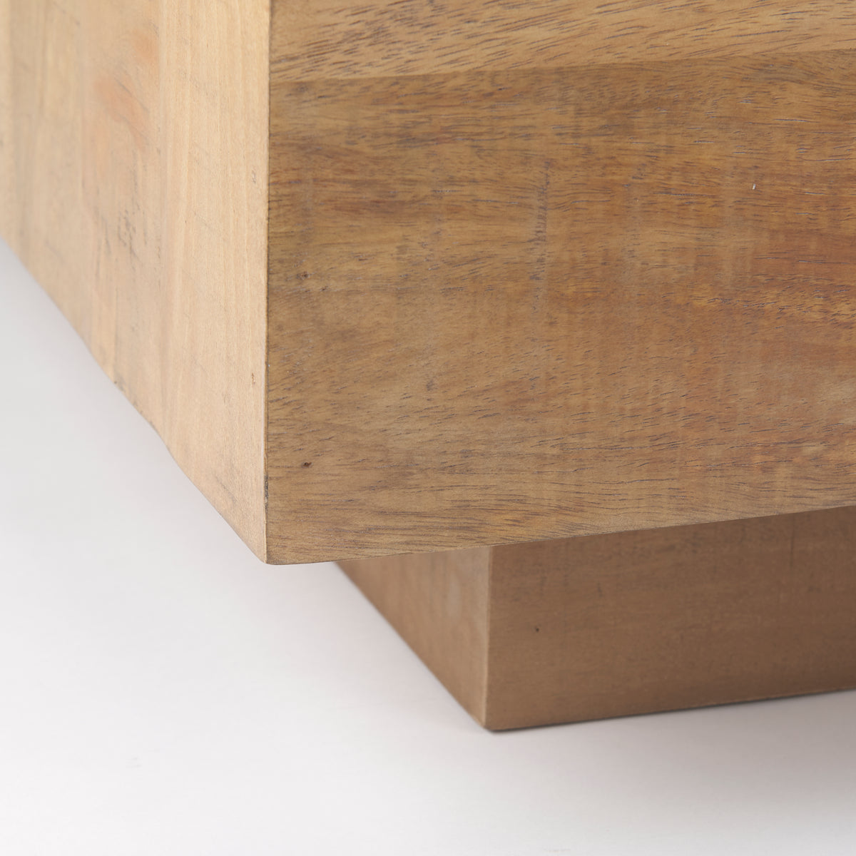 Detail shot of the bottom corner showing the recessed plinth base that gives the Aero table a floating appearance.