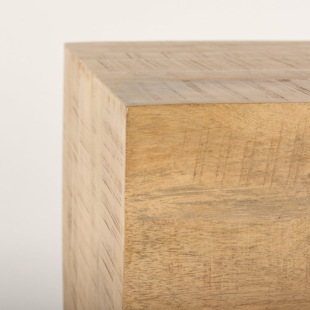 Wooden cube with a light finish on a white background