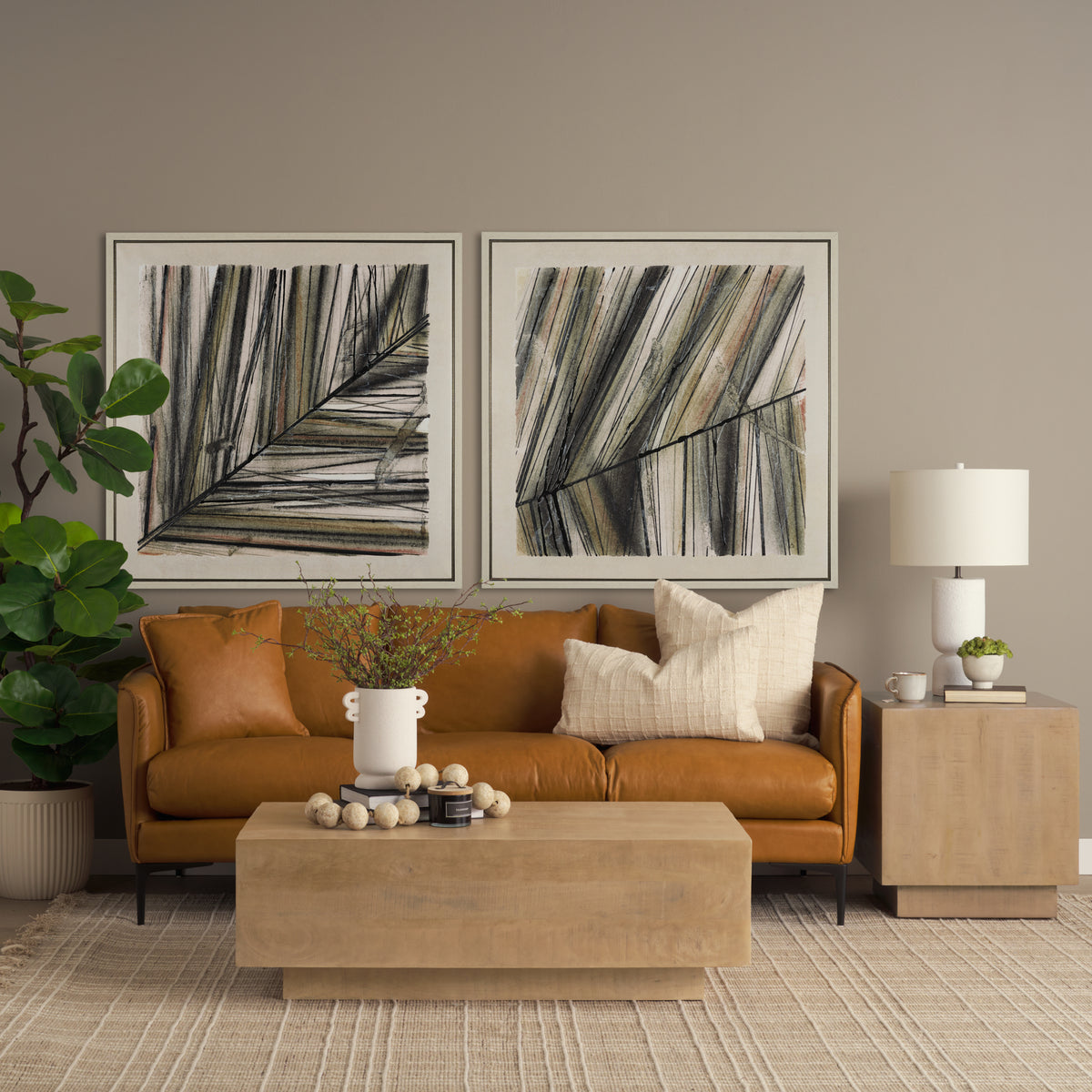 Modern living room with brown sofa, abstract art, and decorative items.