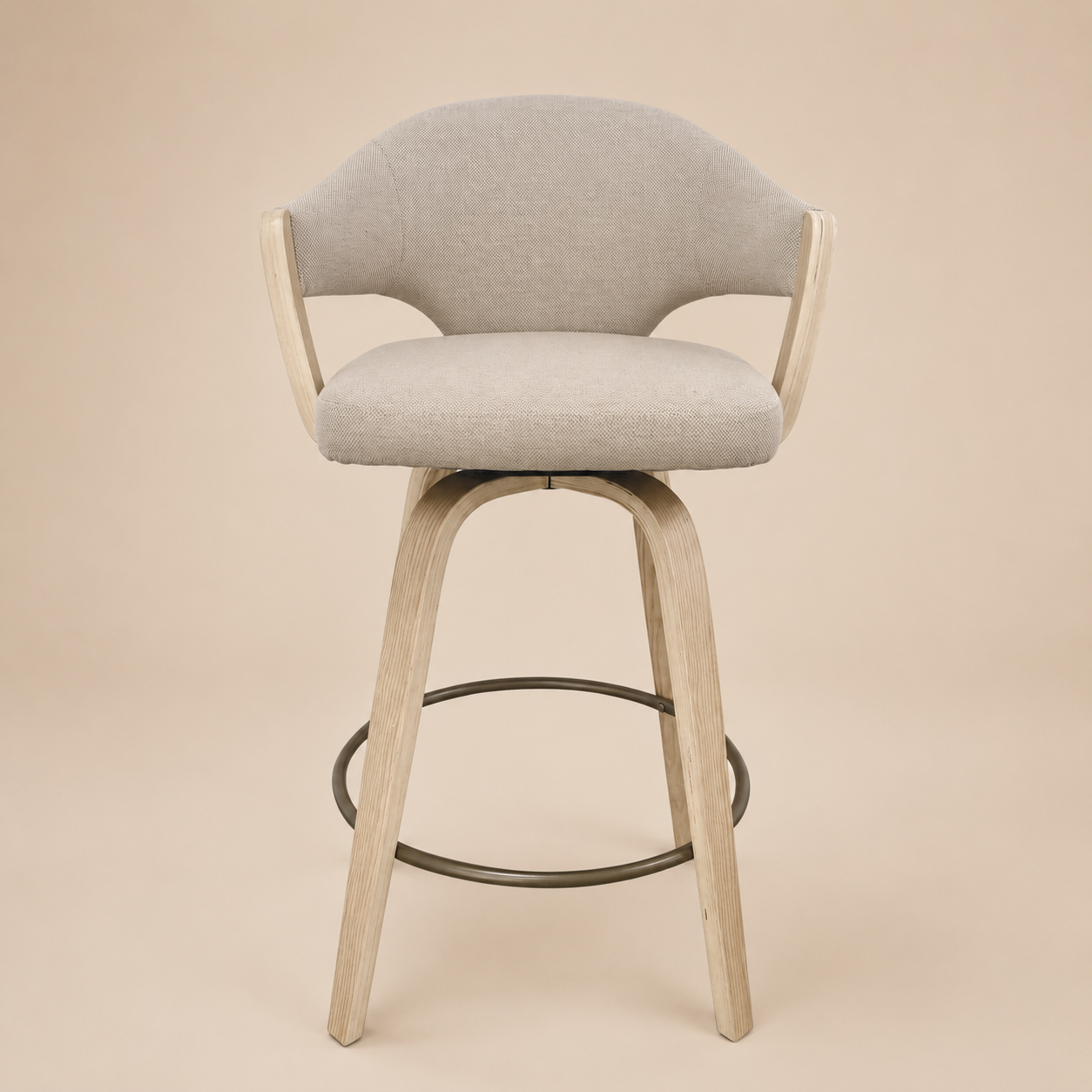 Gray cushioned bar stool with wooden legs on a beige background