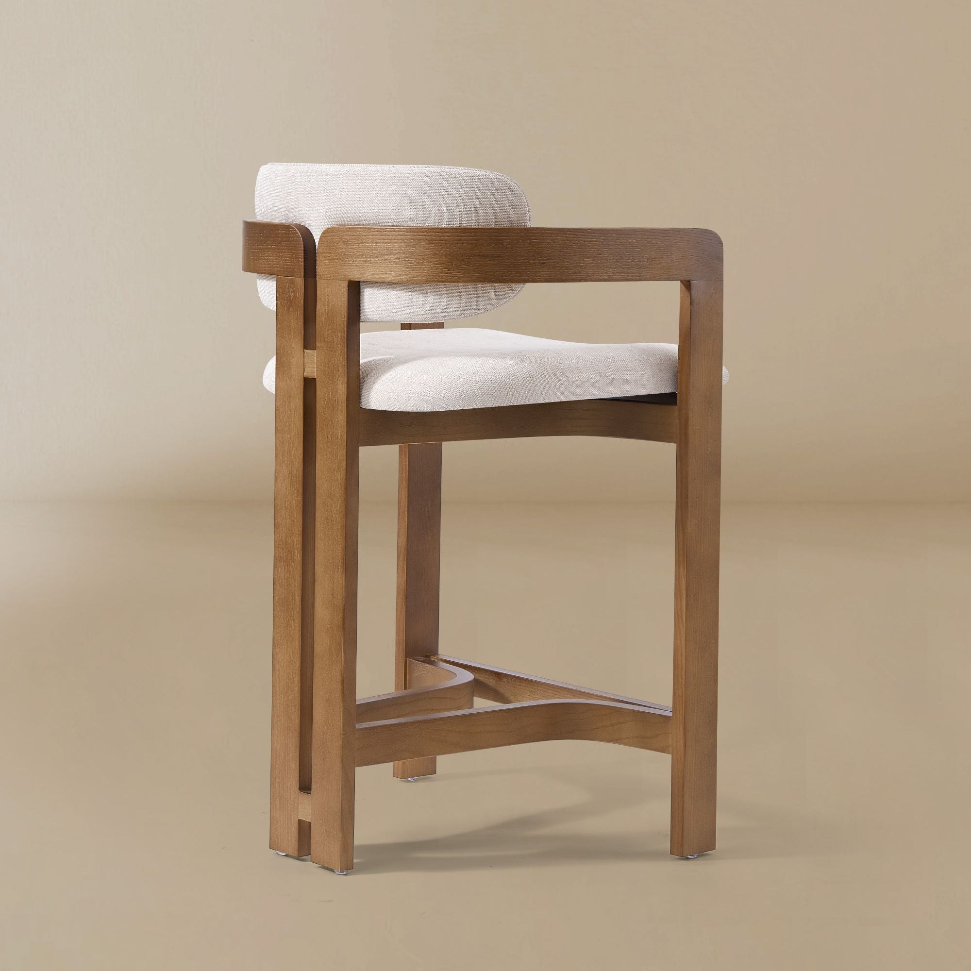 Ash wood counter stool with linen cushioned seat and backrest on a beige background