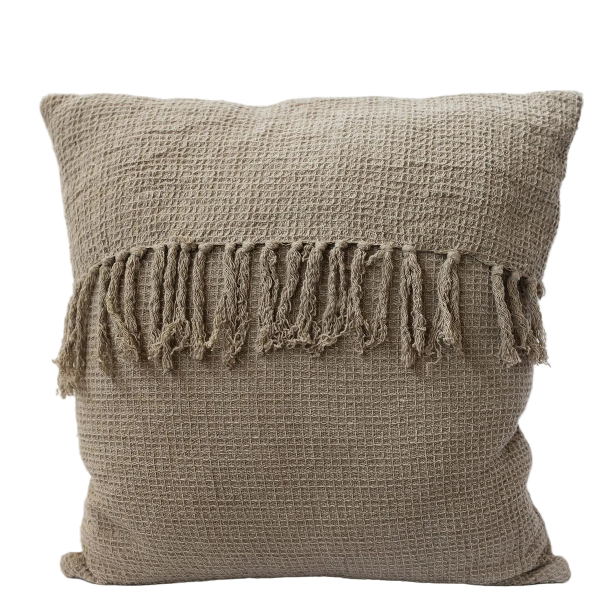 Beige textured pillow with tassels on a light gray background