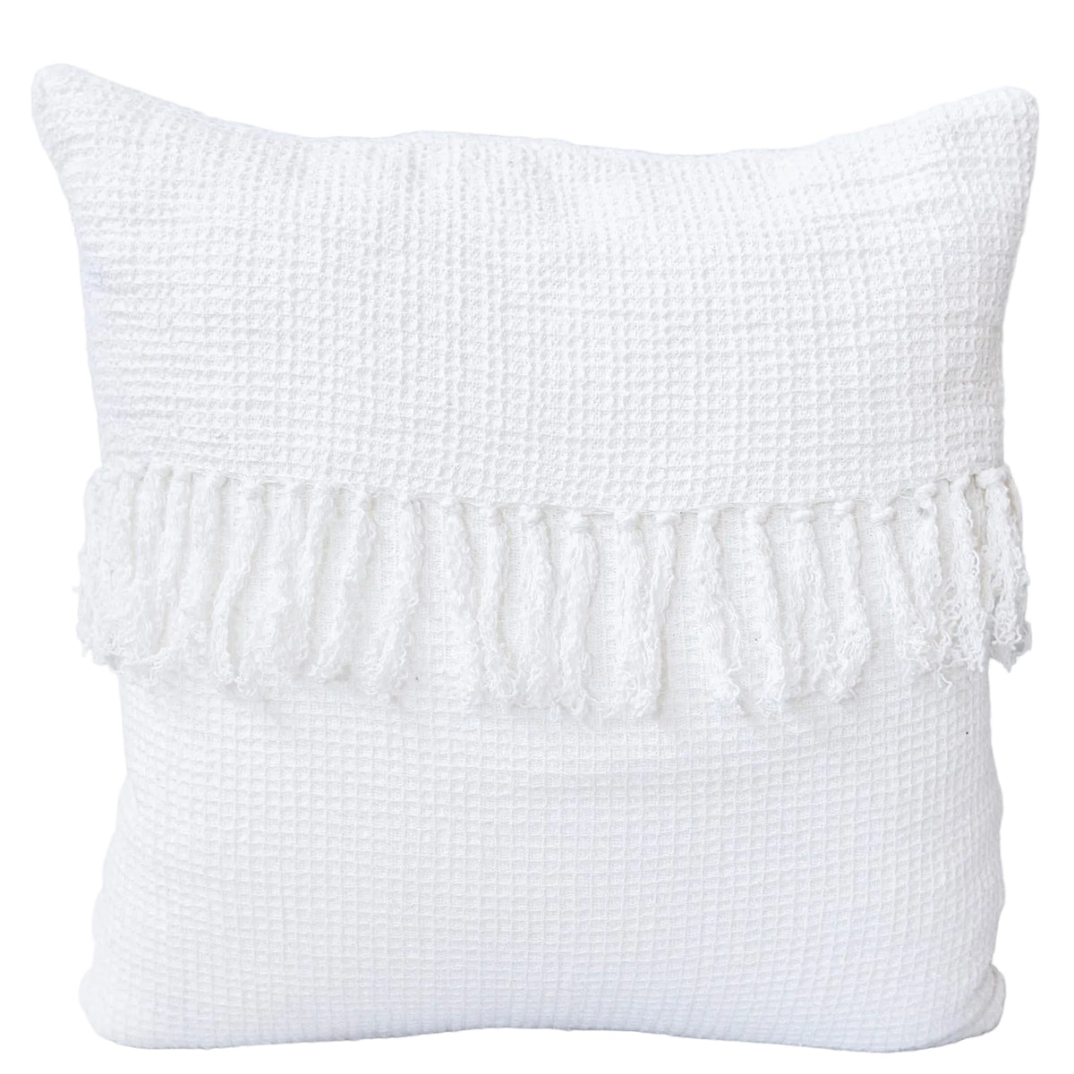 White textured pillow with fringe on a gray background