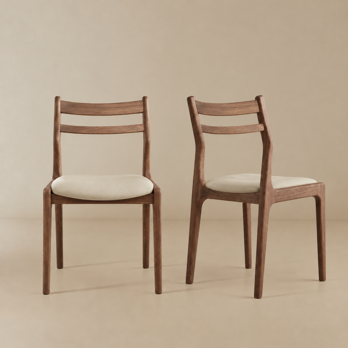 Aspen classic dining chair with cream upholstered seats, shown from the front and side against a warm beige studio background.