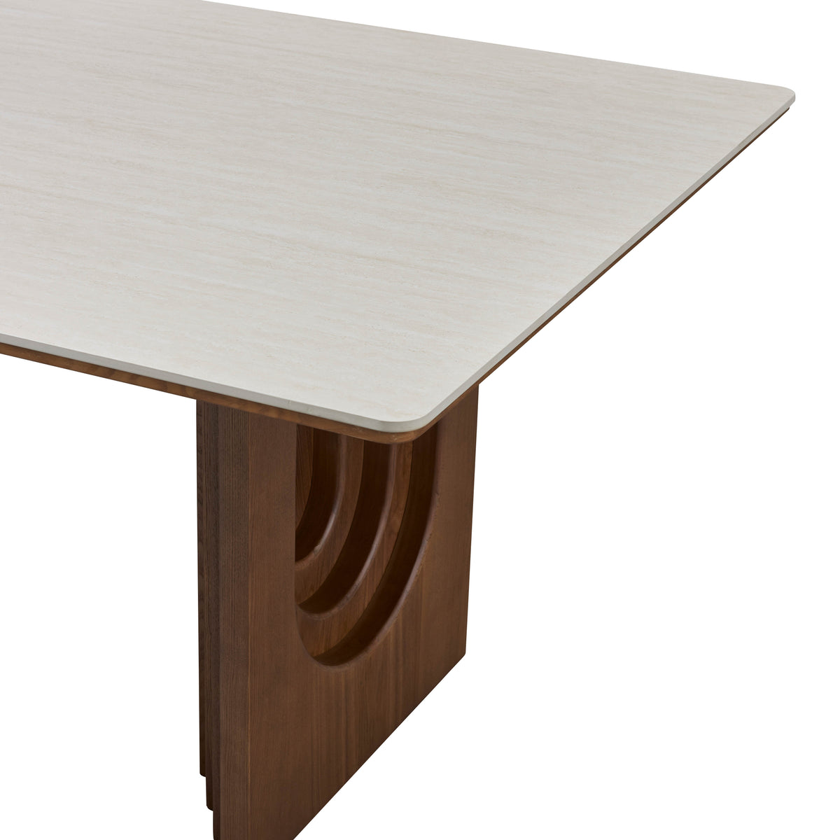 Corner detail of the Arcadian Dining Table with white travertine top and wooden base on a white background