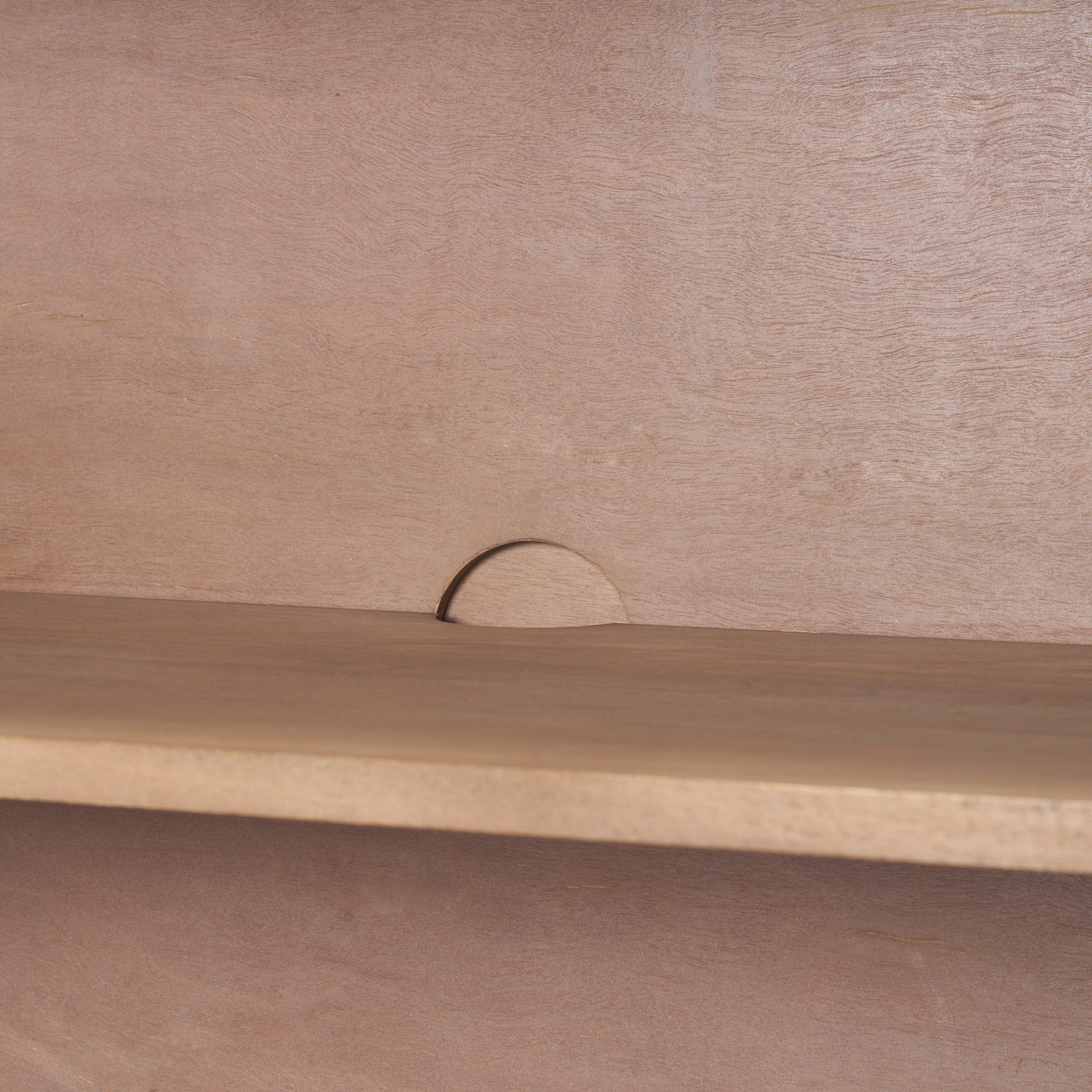 Interior detail of Arco cabinet showing shelf placement and rear cutout for cord management.