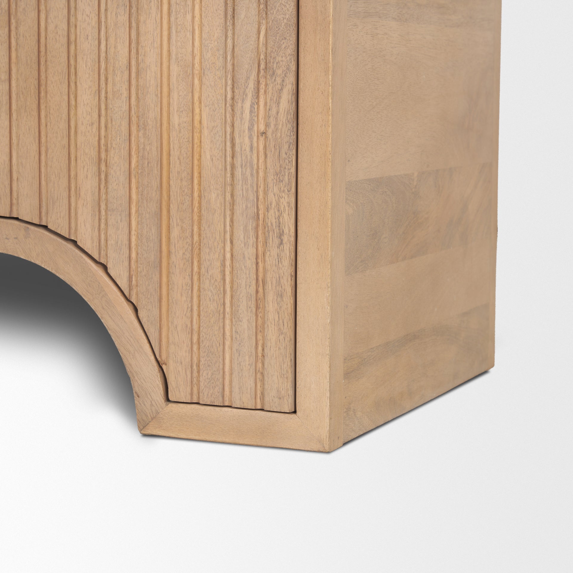 Close up detail of the Arco cabinet showing the intricate routed geometric lines and rounded base.