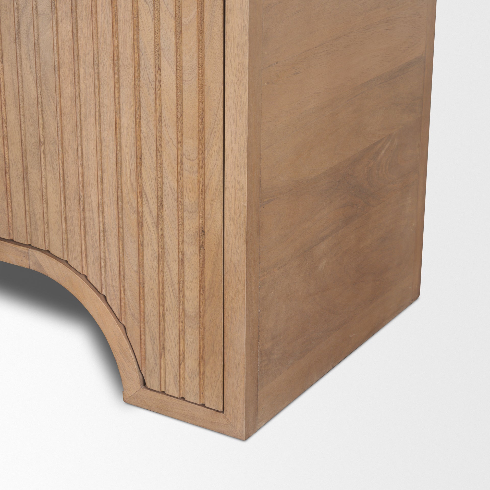 Close up detail of the Arco tall cabinet showing the intricate routed geometric lines and rounded base legs.