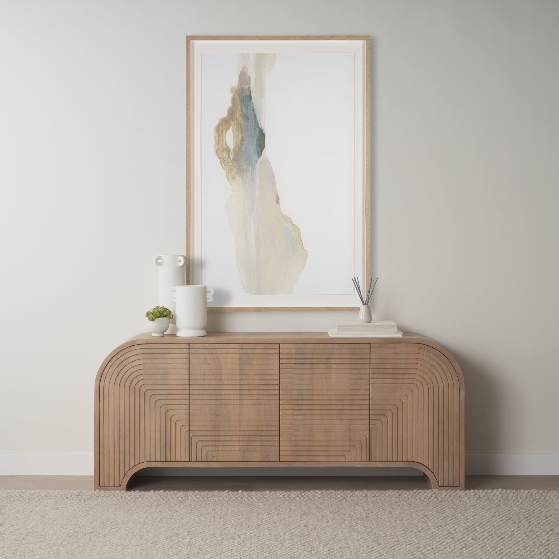 Arco fluted sideboard styled in a modern neutral living room beneath abstract wall art.