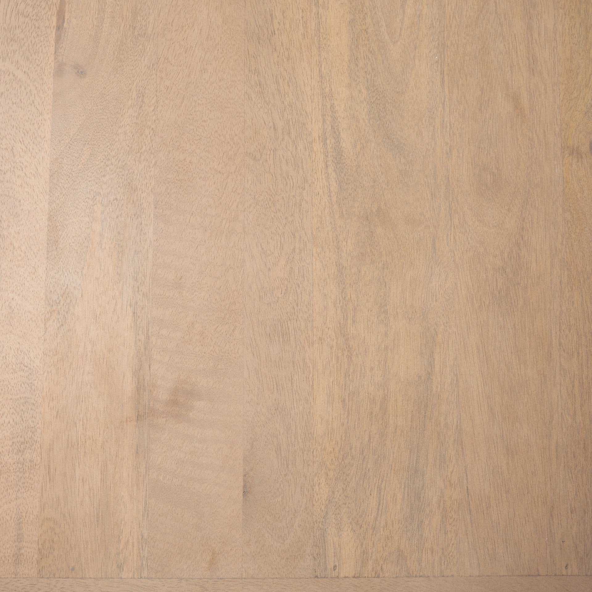 Close up texture shot of the natural light mango wood grain and smooth finish.