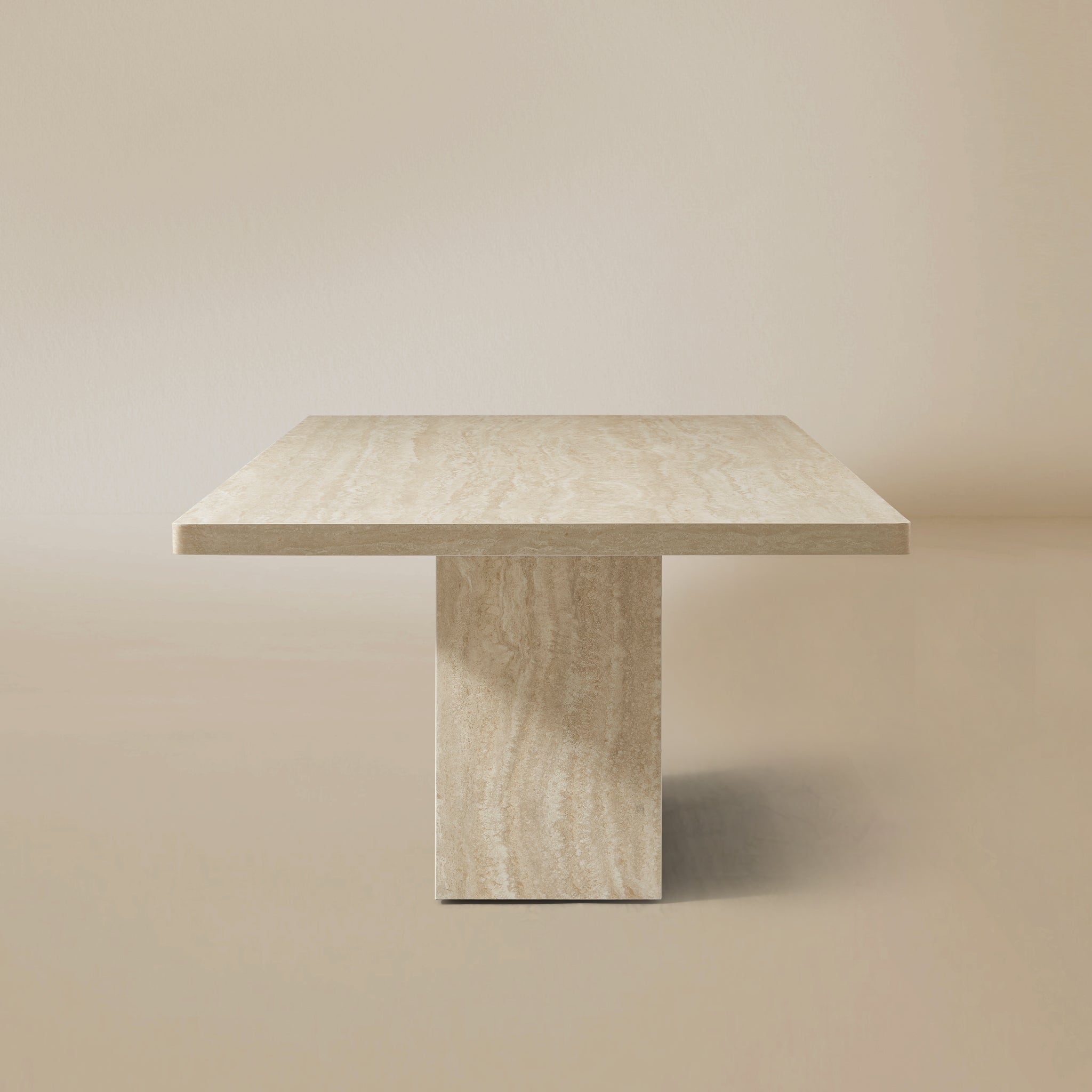 Side view of the Ardella sintered stone dining table with sculptural pedestal base
