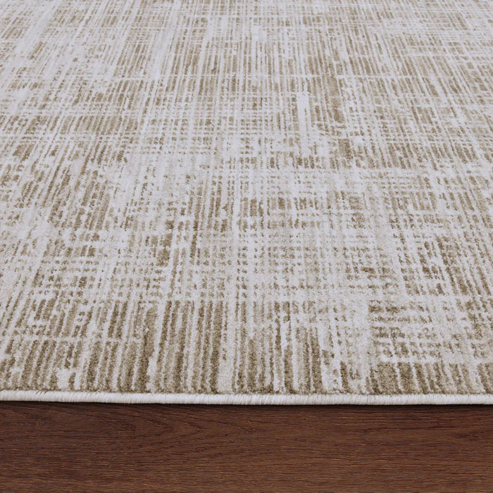 Textured beige and brown rug on a wooden floor