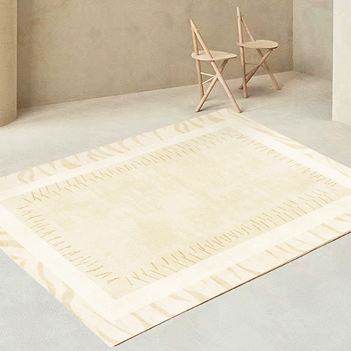 Artisan Stitched Ivory Rug styled in a minimal room with light wood chairs