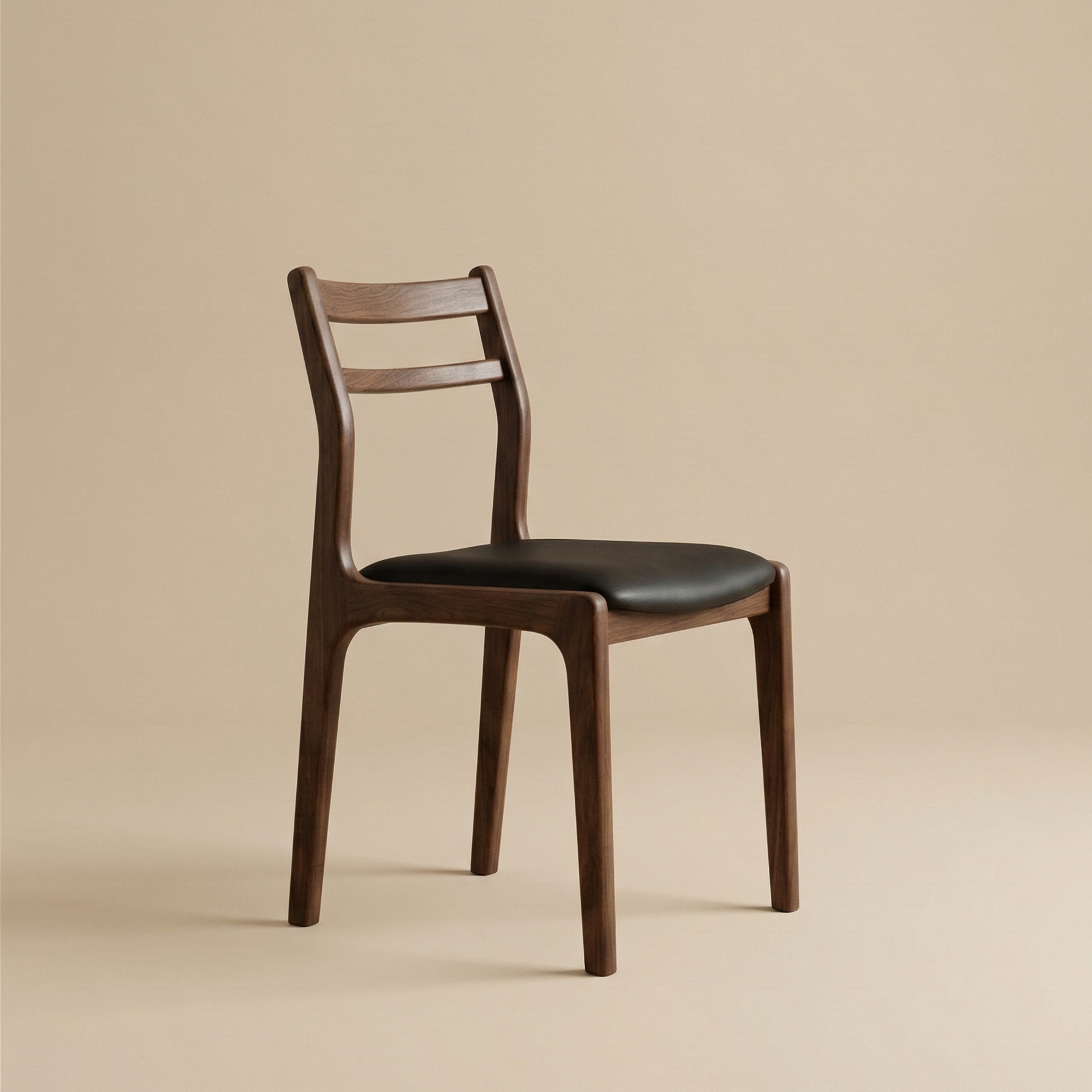 Angled view of the dark wood Aspen dining chair highlighting its curved slat backrest and sleek black seat.