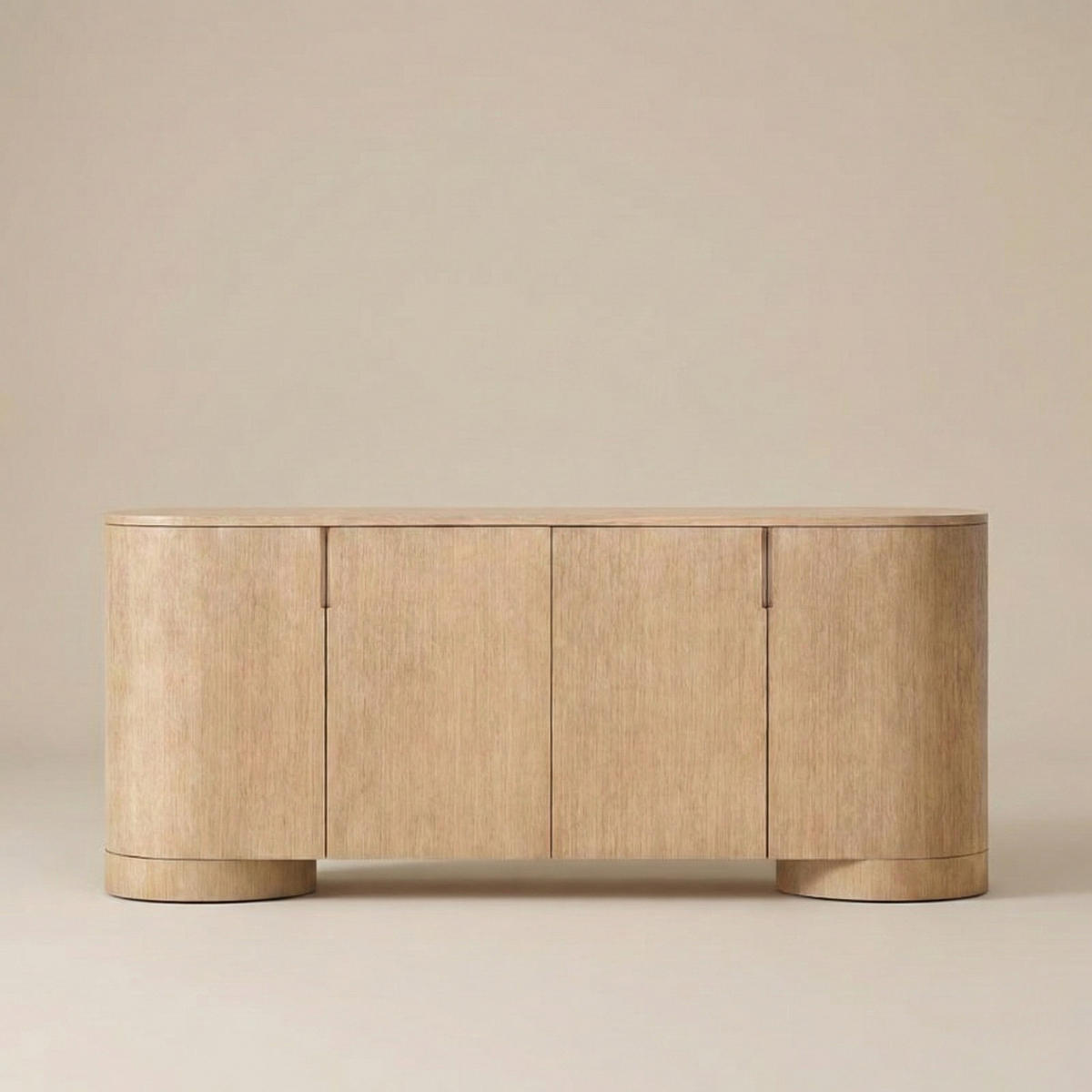 Front view of the Aurelian light oak sideboard showing the seamless four-door design and natural wood texture