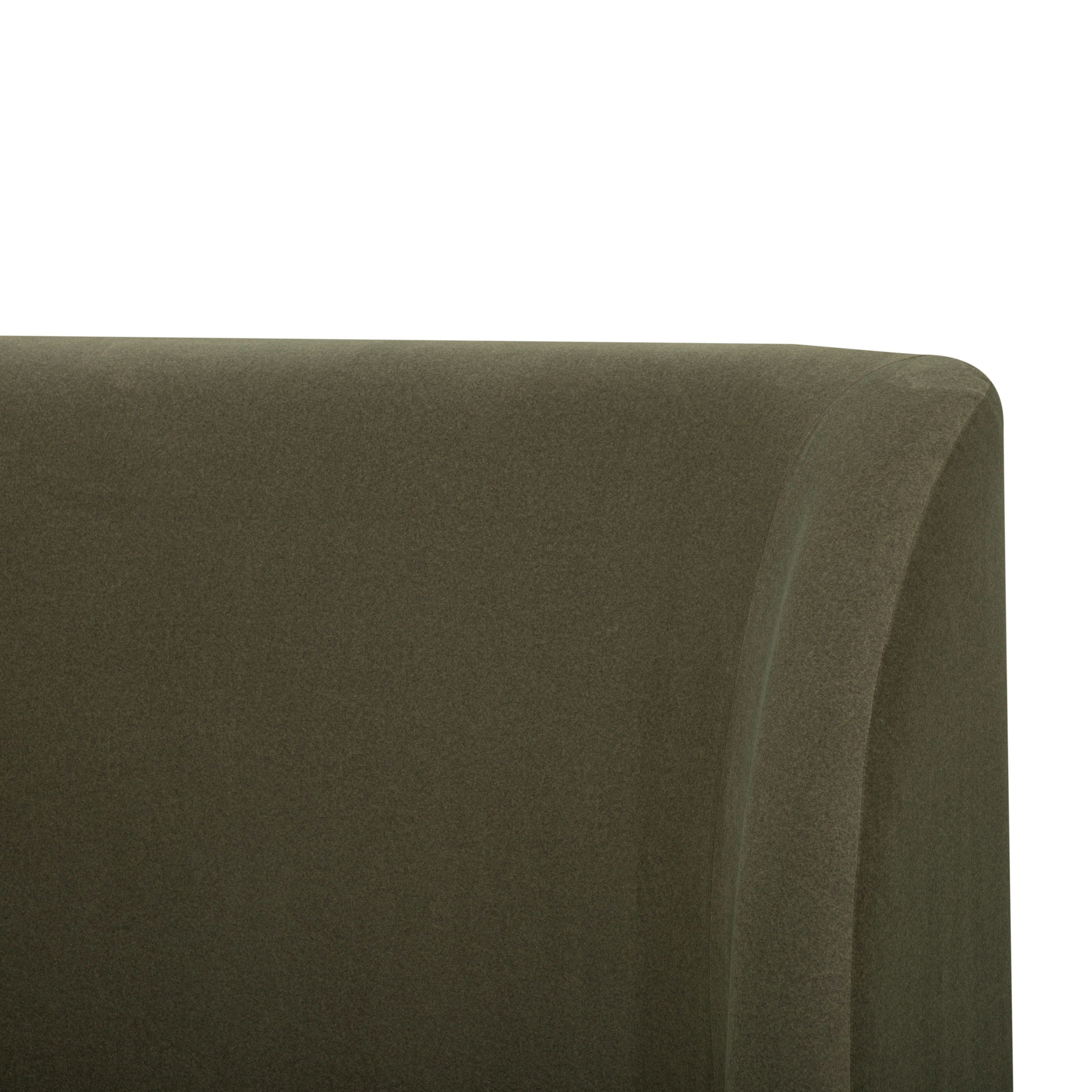 Close-up of a dark olive green upholstered Aveline Velvet Bed corner showing the fabric texture against a white background.