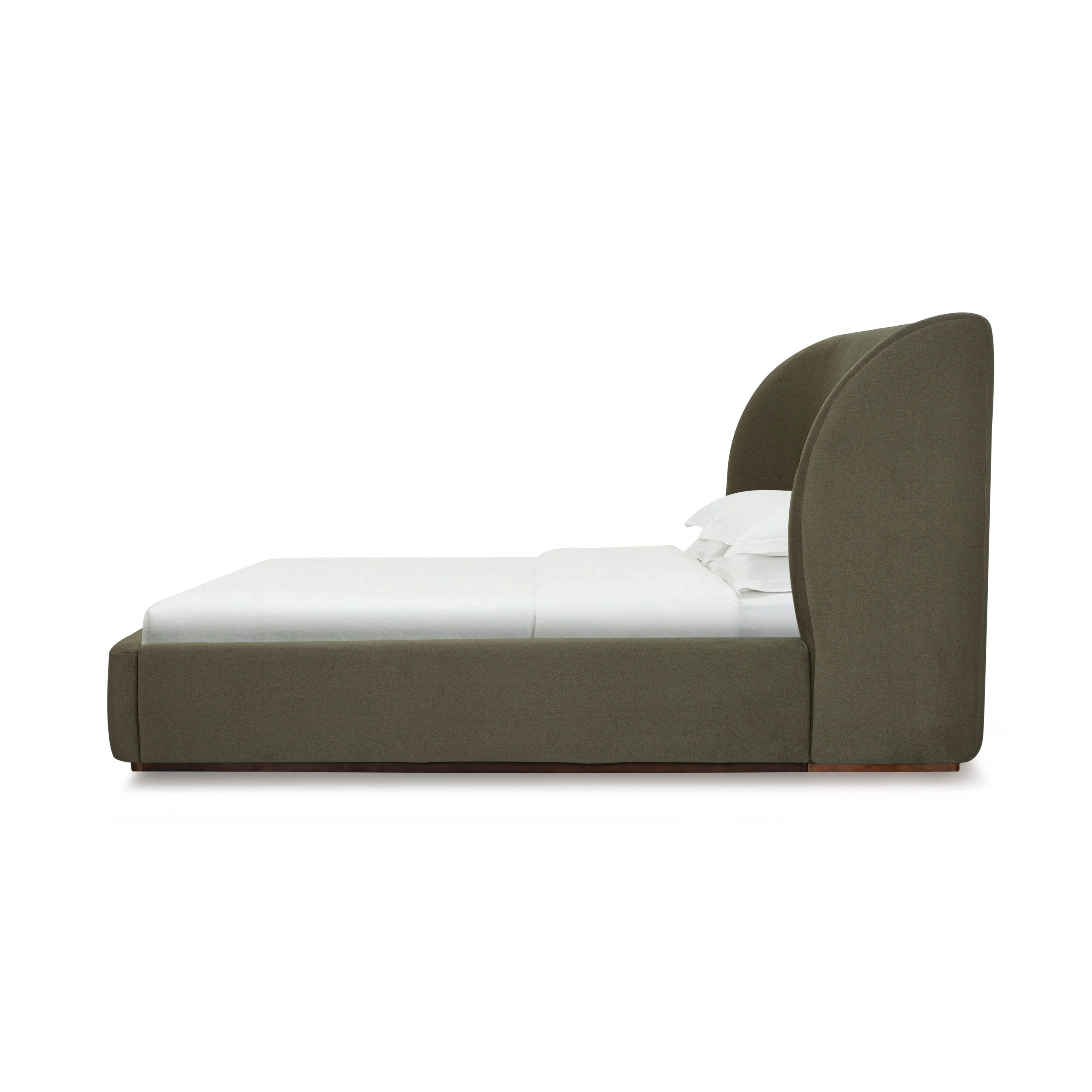 Side view of the Aveline Velvet Bed in white background