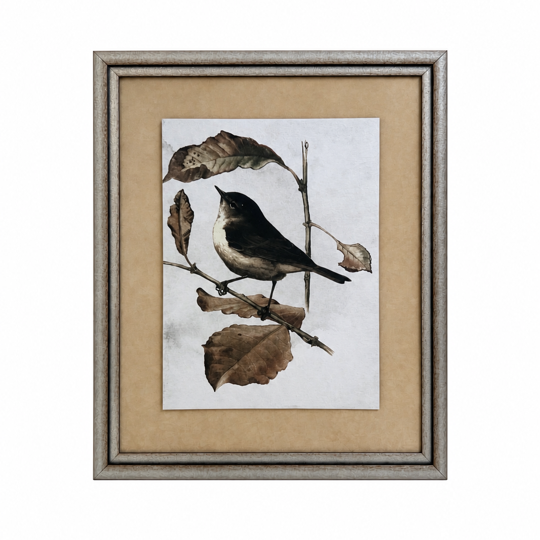 Framed artwork of a bird on a branch with leaves