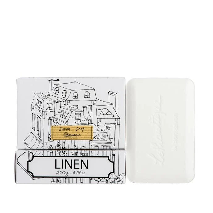 Bar of soap with packaging labeled 'Linen' on a white background