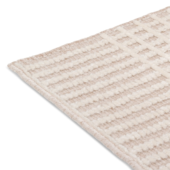 Close-up of the high-low pile and tidy bound edge on the cream and beige Beckett textured stripe rug.