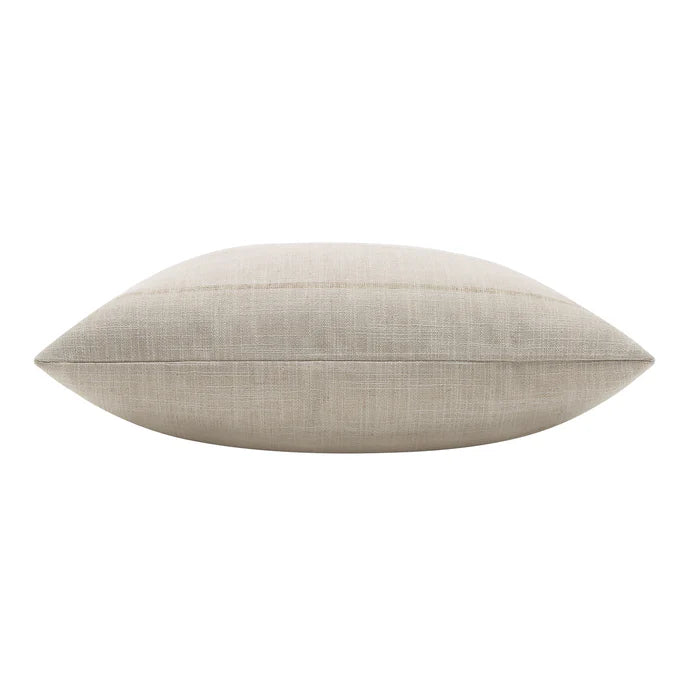 Side profile view of the plush beige Beckett woven throw pillow highlighting its thickness and subtle striped pattern.