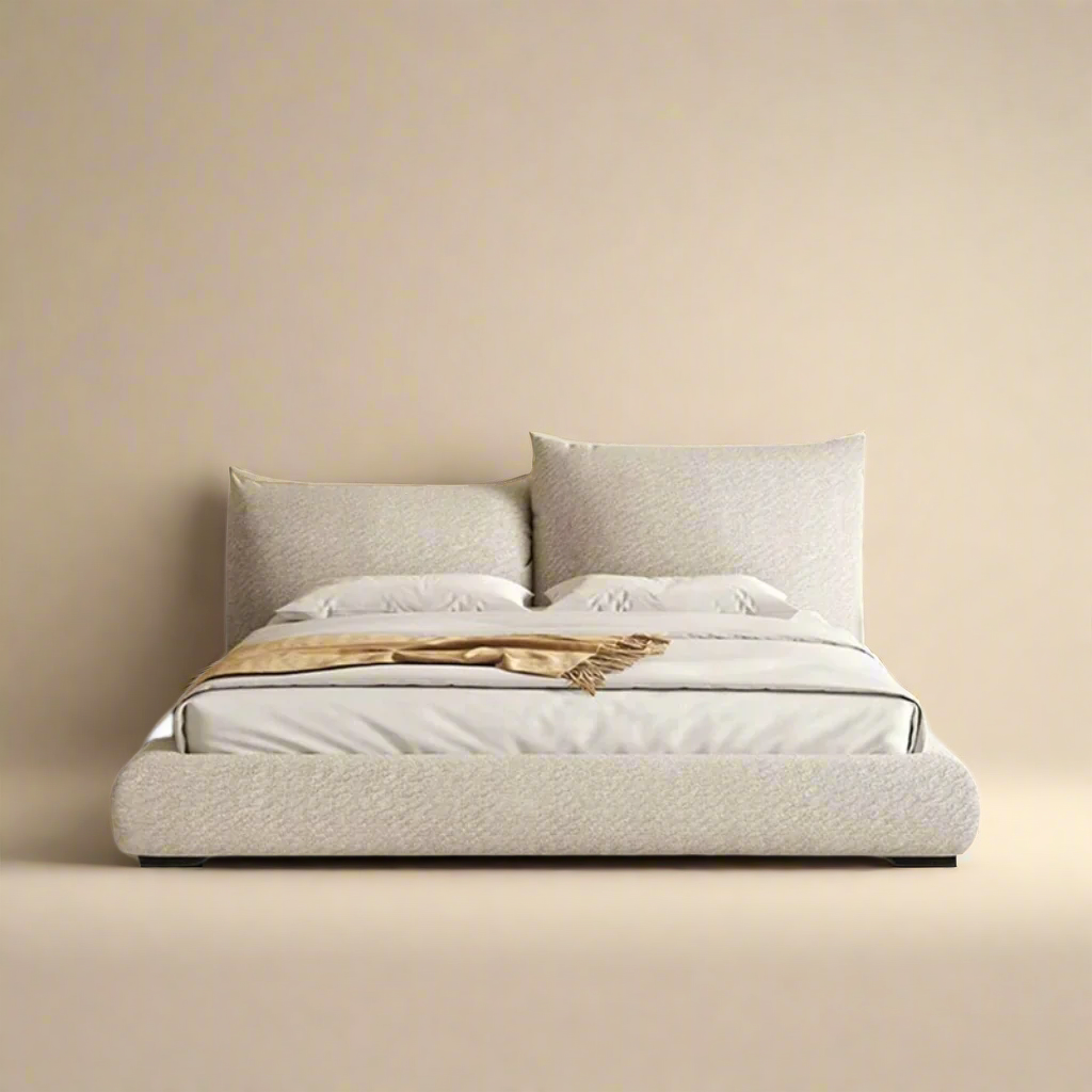Blooming Embrace bed frame featuring a soft split-pillow headboard design and textured beige upholstery.
