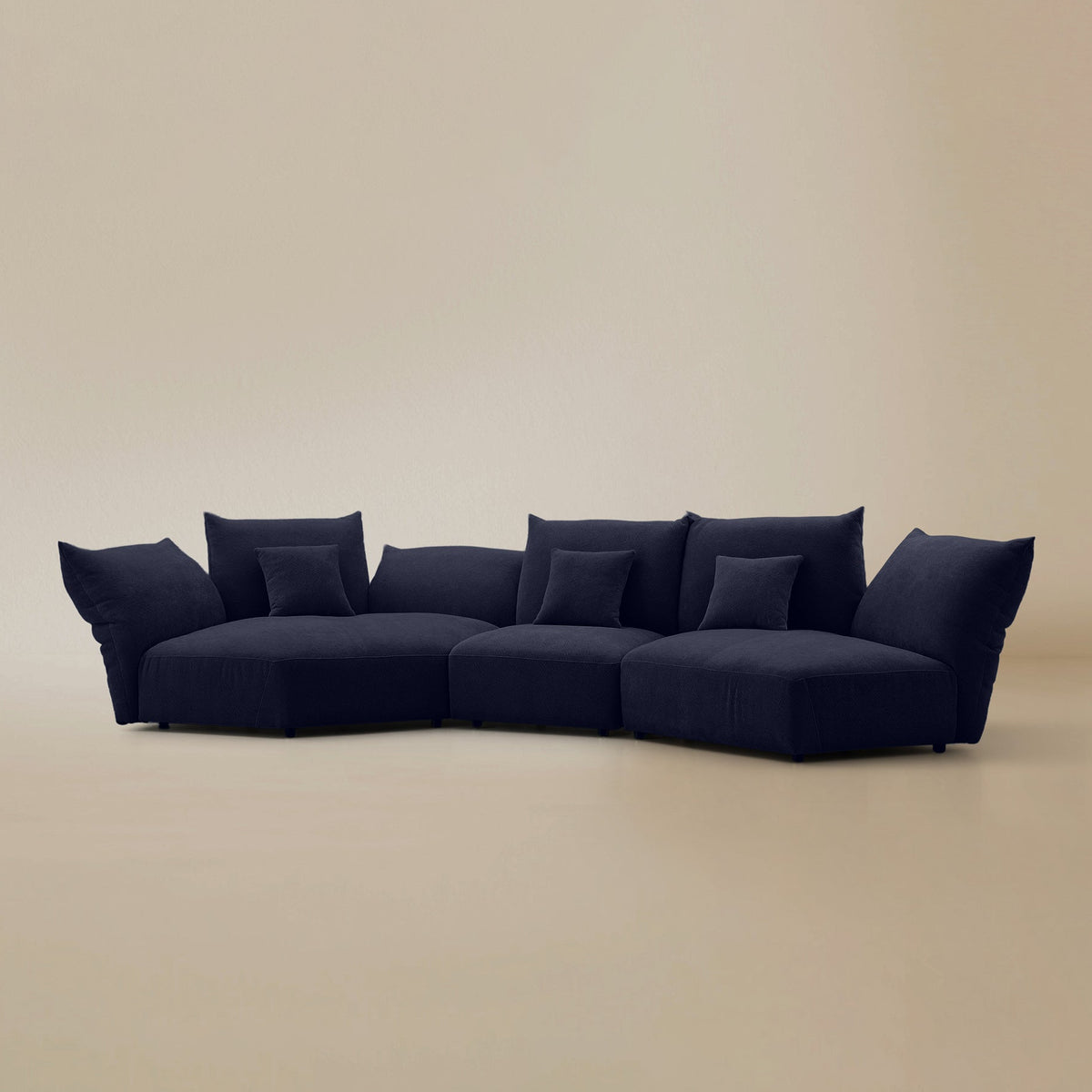 Angled view of the Blooming Embrace Modular Sofa, Combo B, in Serenity Blue chenille on a beige studio background