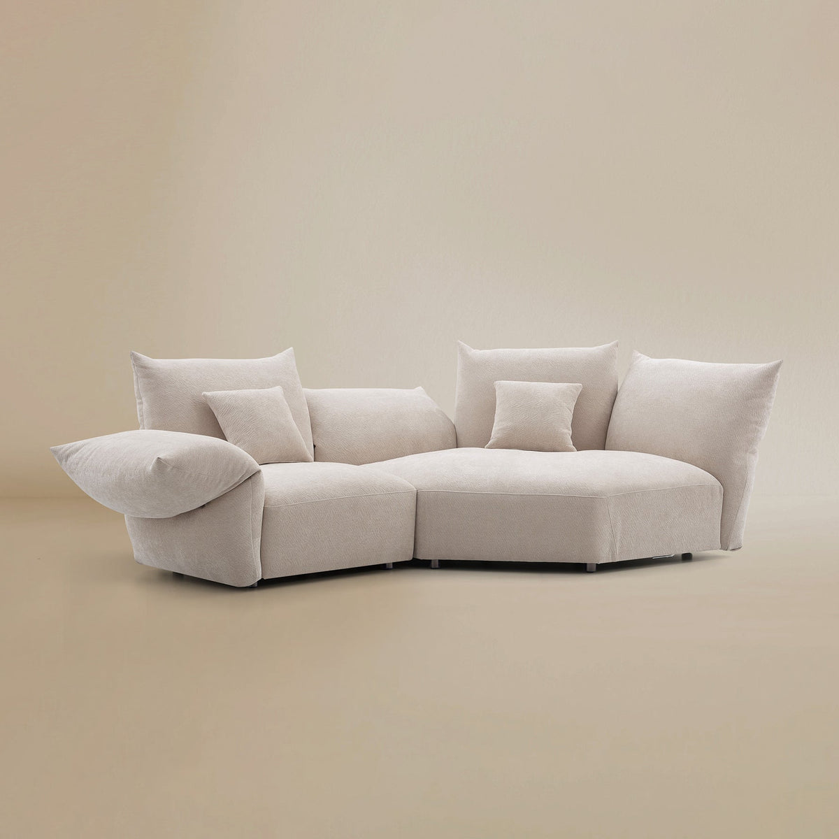 Angled view of the Blooming Embrace Modular Sofa, Large Chaise with One Seater, in Pearl White chenille on a beige studio background