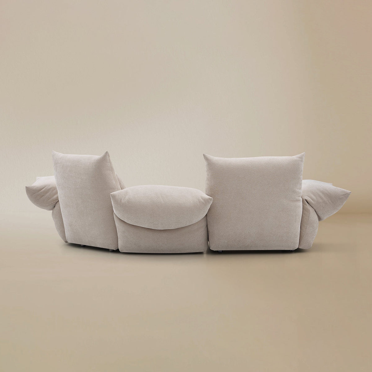 Back view of the Blooming Embrace Modular Sofa, Large Chaise with One Seater, in Pearl White chenille on a beige studio background