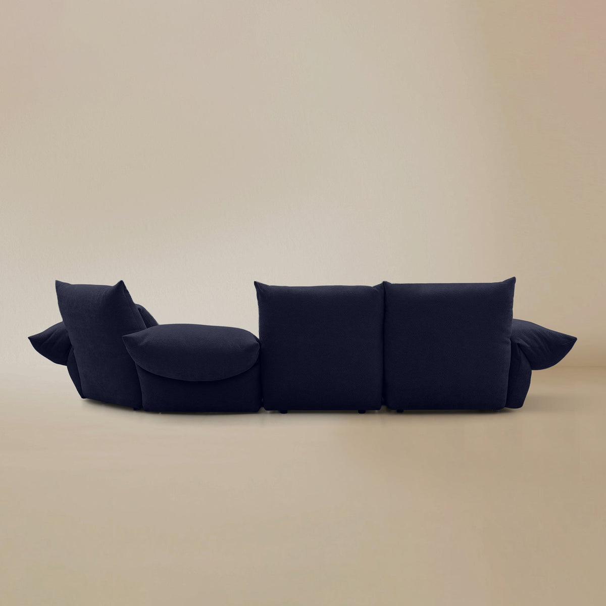Back view of the Blooming Embrace Modular Sofa, Large Chaise with Two Seater, in Serenity Blue chenille on a beige studio background