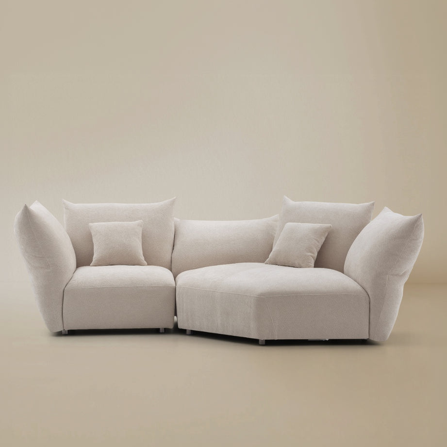 Blooming Embrace Modular Sofa in pearl chenille fabric in one seater with large chaise configuration on beige studio background