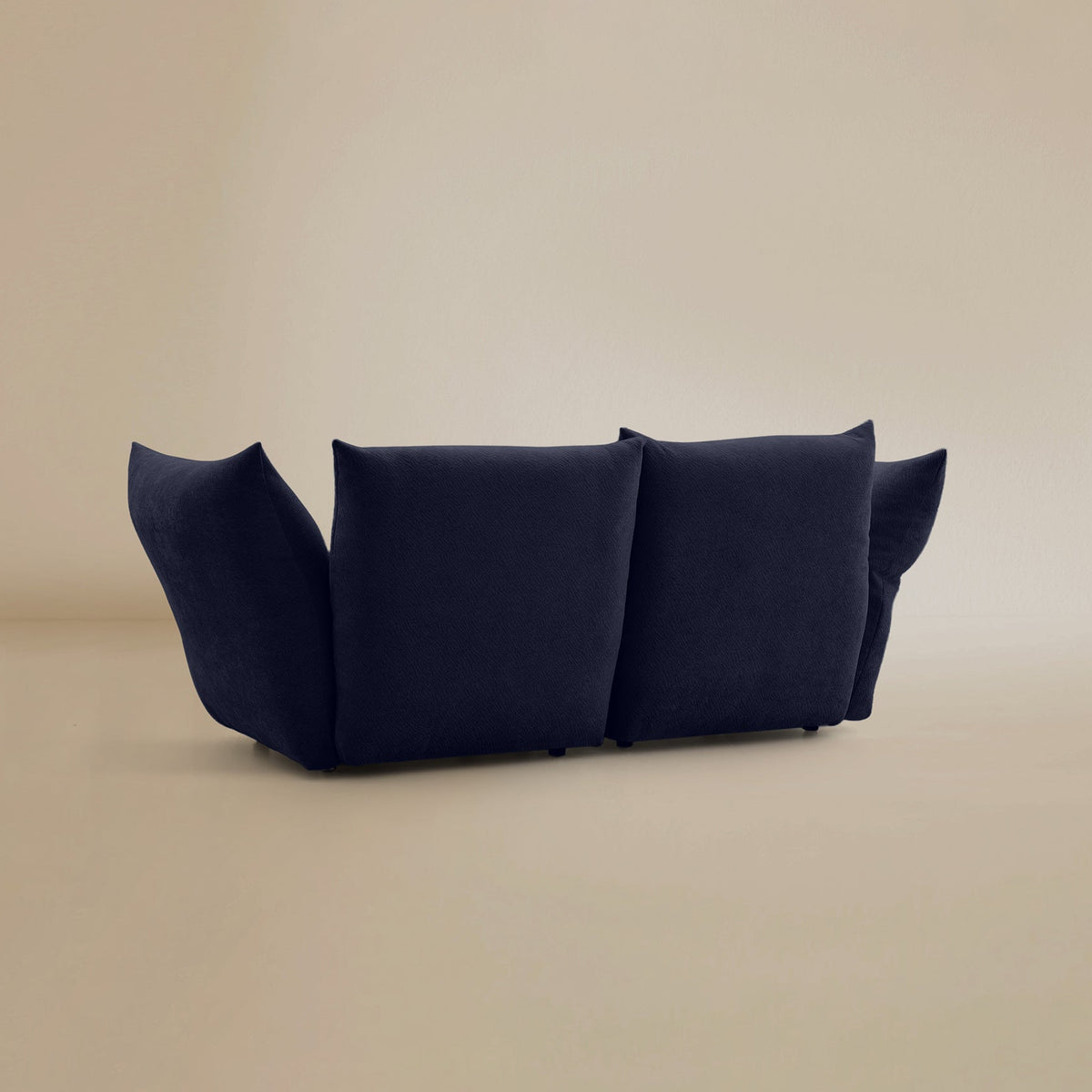 Back view of the Blooming Embrace Modular Sofa, Two Seater, in Serenity Blue chenille on a beige studio background
