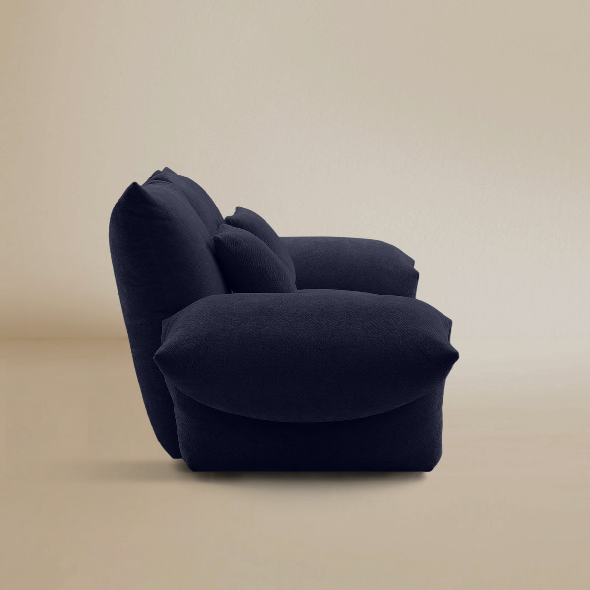 Side view of the Blooming Embrace Modular Sofa, Two Seater, in Serenity Blue chenille on a beige studio background