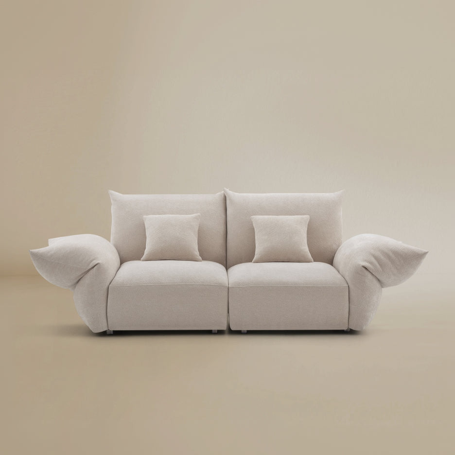 Two seater Blooming Embrace Modular Sofa in pearl chenille fabric with plush cushions and curved silhouette on beige studio background