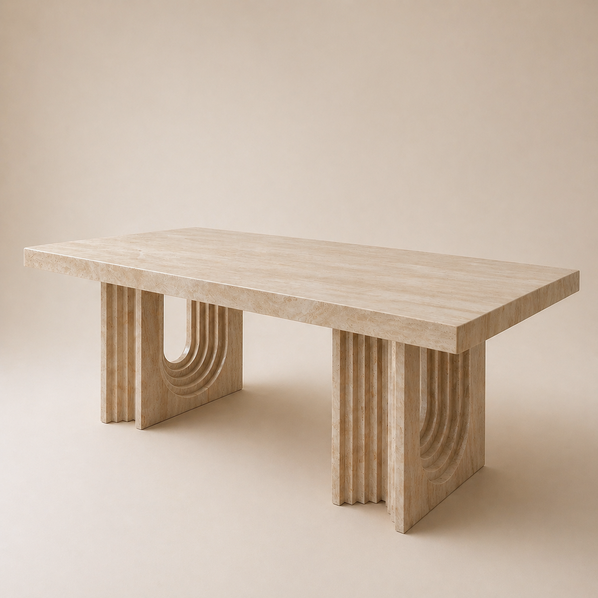 Angled view of a travertine dining table on a beige background.