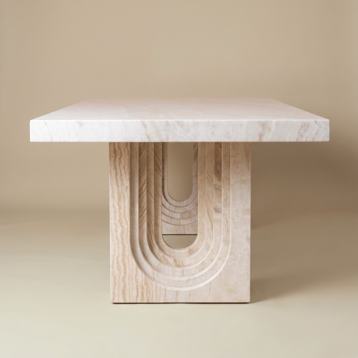 Side view of a traverine dining table on a beige background.