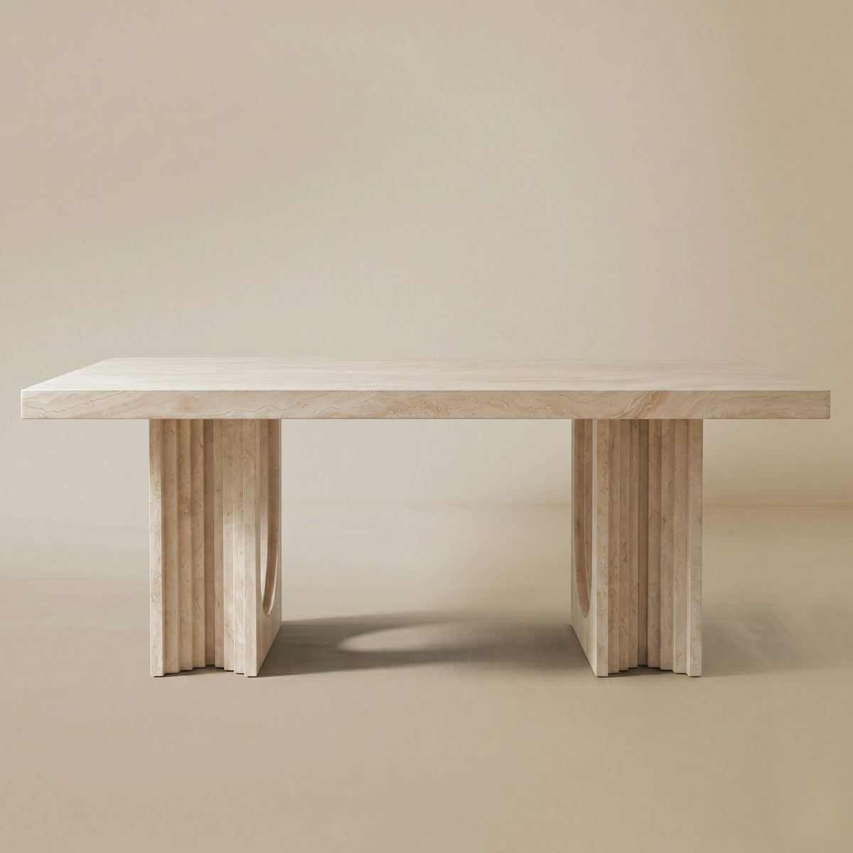 Natural travertine dining table on a beige background.