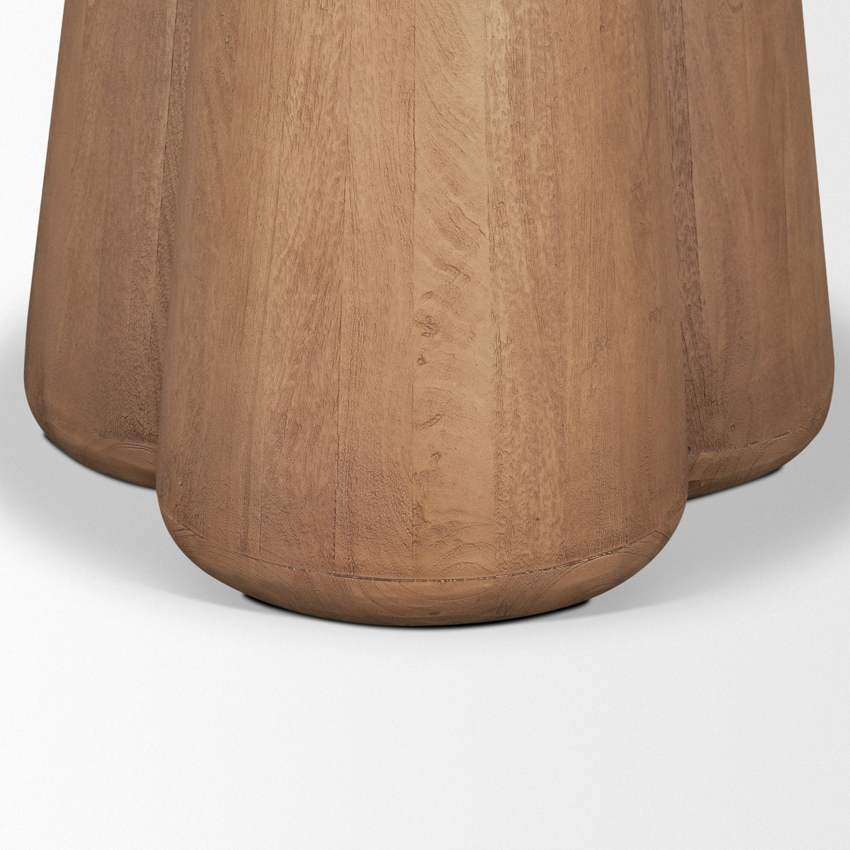 Sculptural solid mango wood pedestal base of the Caspia dining table