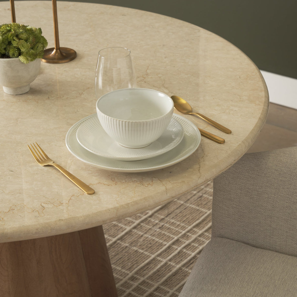 Caspia Botticino marble dining tabletop styled with neutral dinnerware