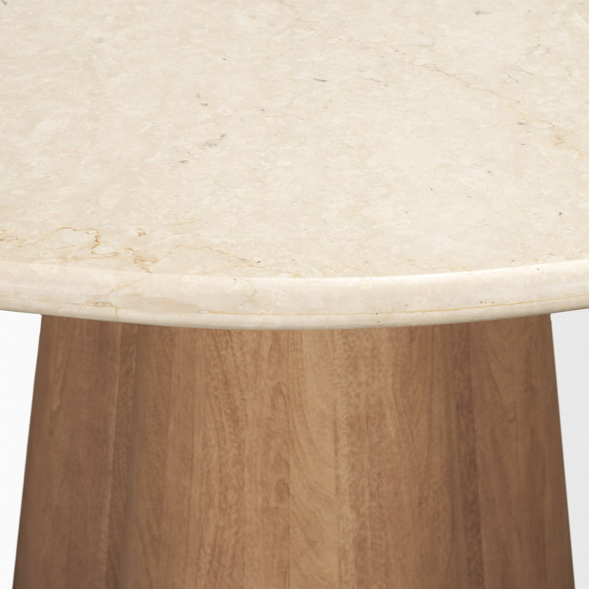 Rounded Botticino marble edge and mango wood pedestal detail on the Caspia dining table