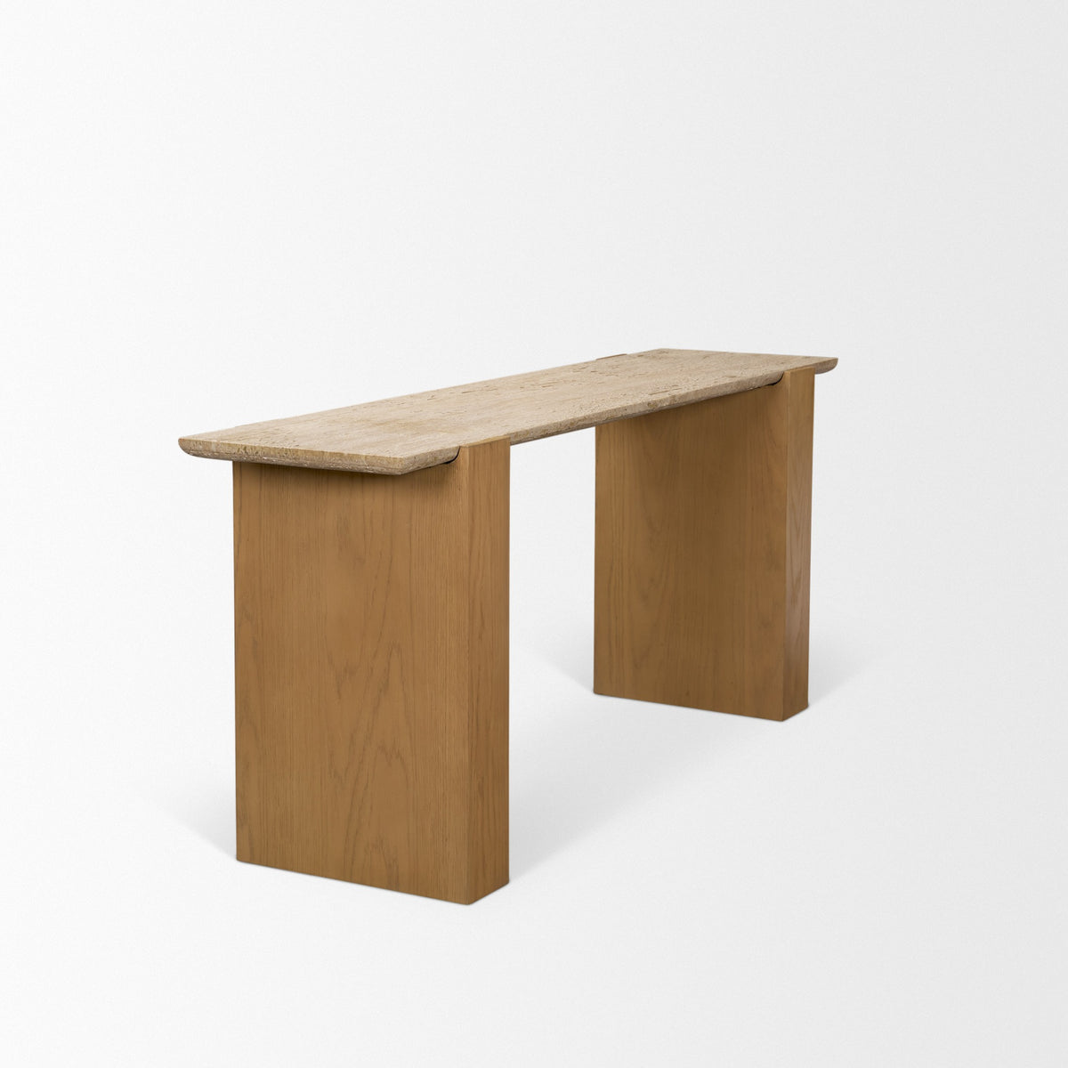 Side angle view of the Cavelle Travertine & Oak Console Table highlighting the stone overhang and wide oak blade-leg construction.