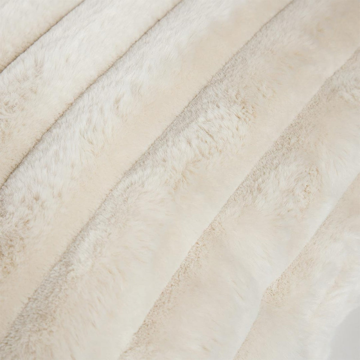 Detailed close-up of the ribbed faux fur square cushion from the Cloudline trio highlighting its soft, channeled texture.