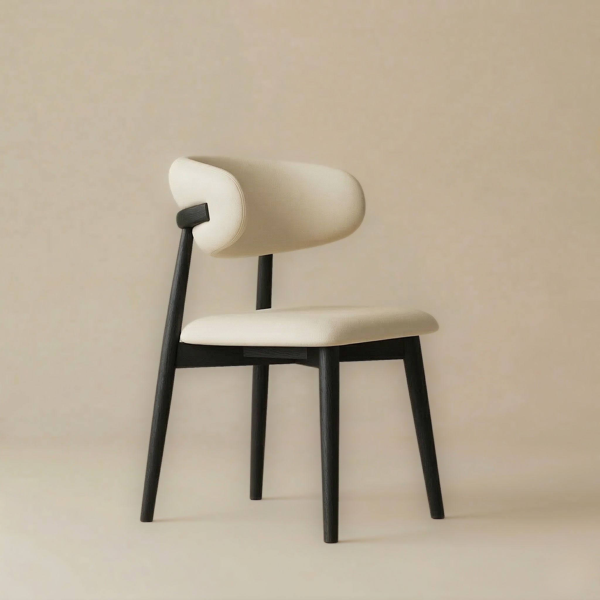 Angled view of the black Modern Leather Ash Wood Dining Chair highlighting the unique wrap-around backrest and tapered black wooden legs.