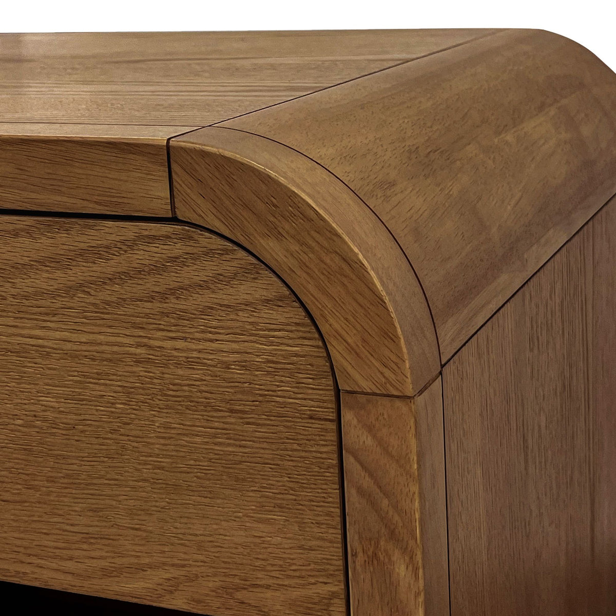 Close-up of a wooden drawer with a curved top