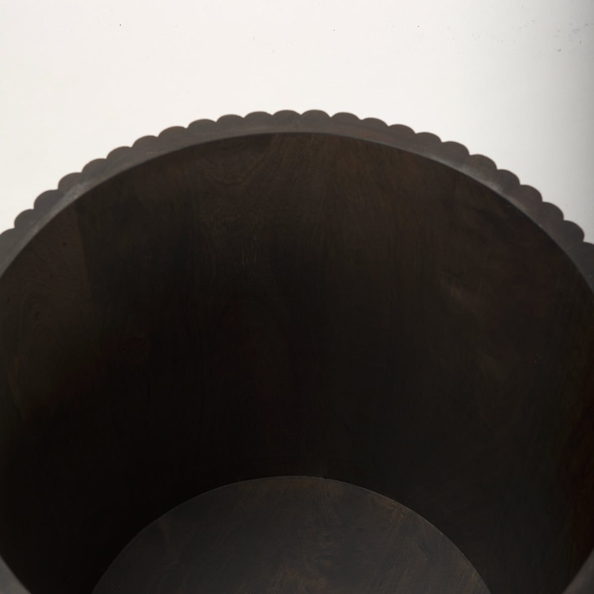 Top-down view inside the empty drum of the dark wood Eleanor fluted side table, showcasing its deep storage capacity.