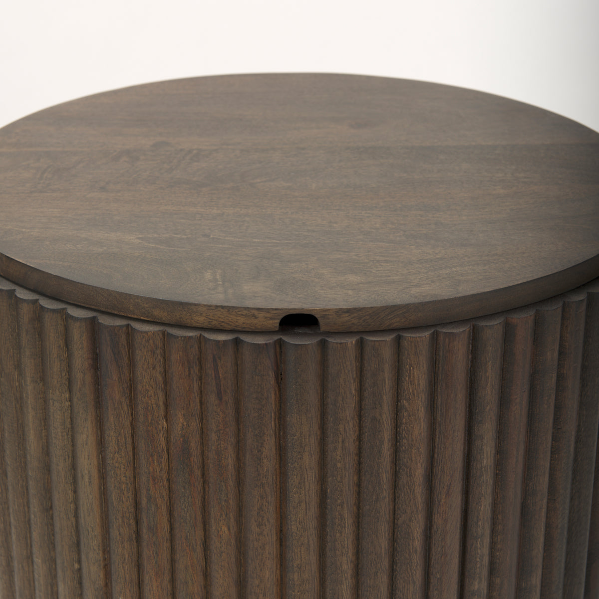 Close-up of the vertical fluted wood detailing and the finger notch on the lid of the dark brown Eleanor side table.