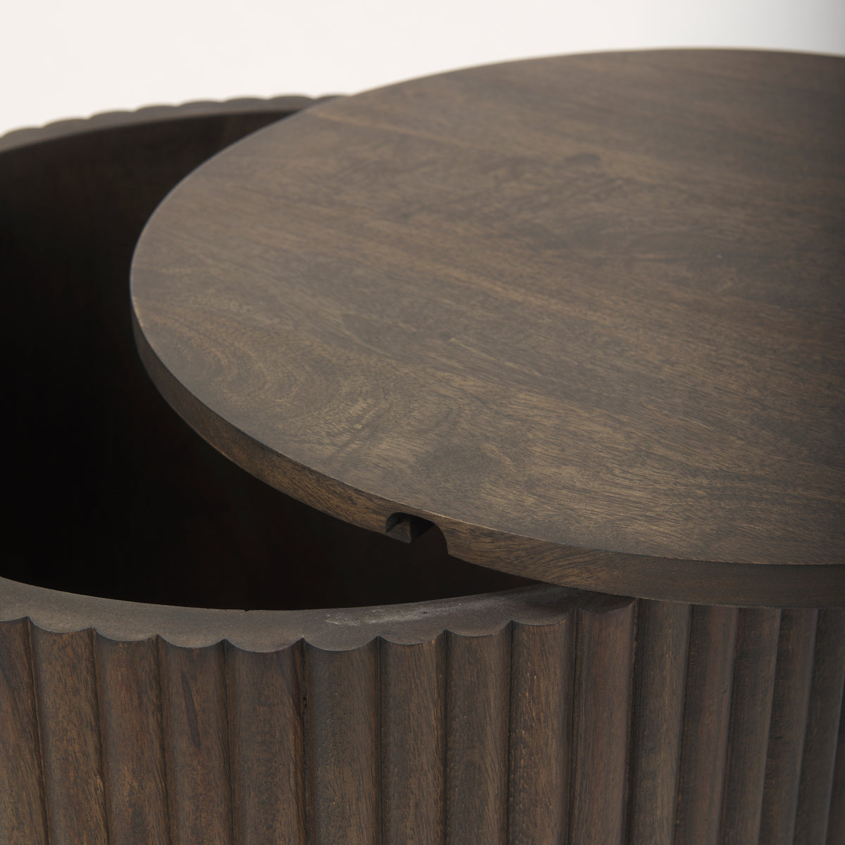 Close-up showing the removable wooden lid slightly ajar on the dark mango wood Eleanor storage side table.