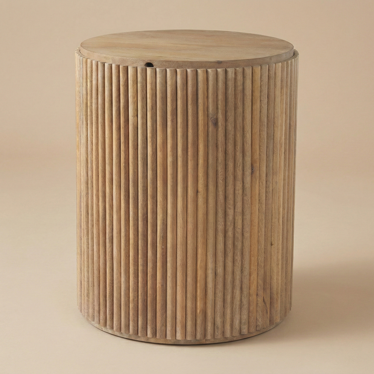 Eleanor Fluted Side Table in light wood color placed in the beige studio background.