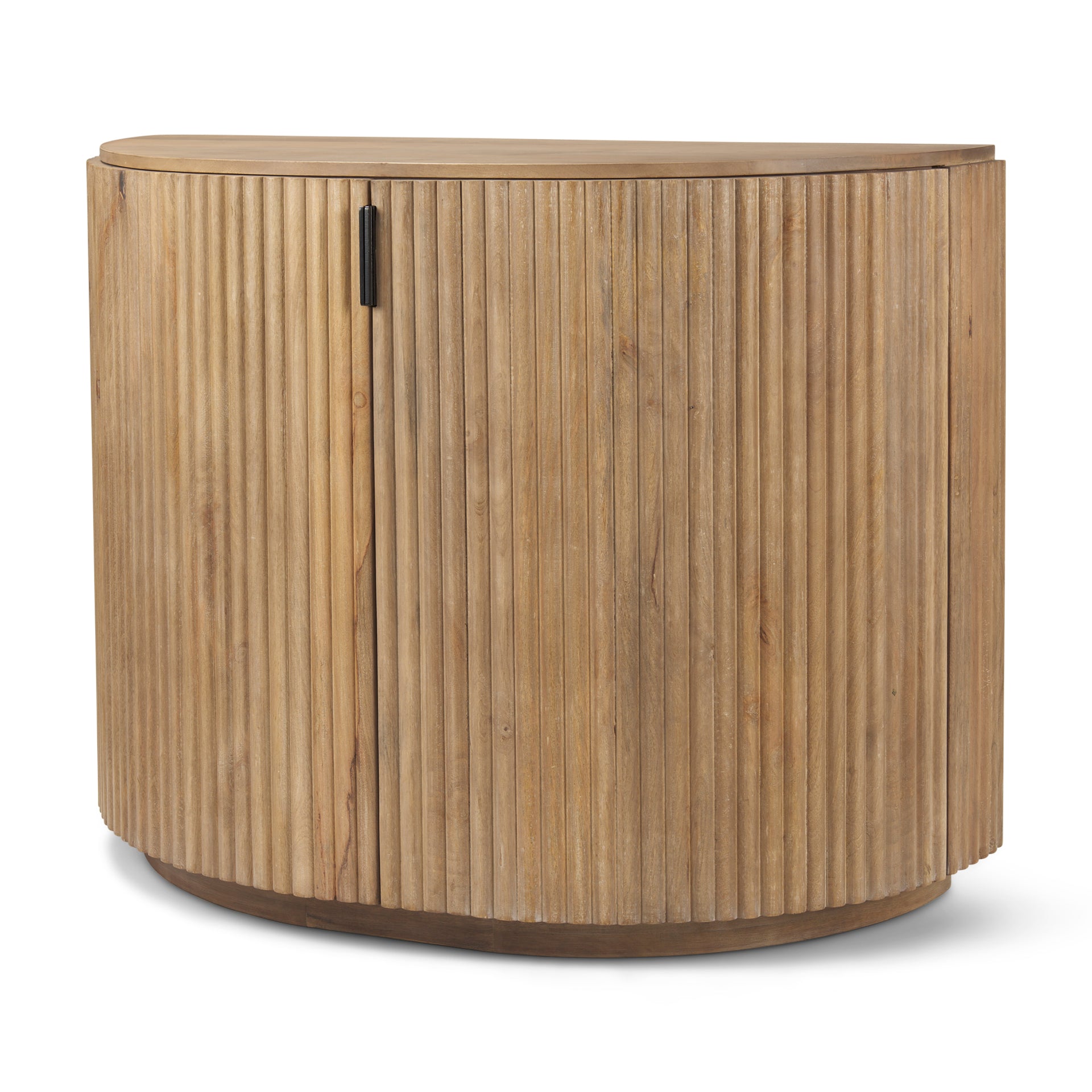 Angled view of the closed Eleanor light mango wood accent cabinet featuring fluted details and black pulls.